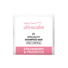 Load image into Gallery viewer, A white shampoo bar package featuring a pink and black label with the brand name &quot;Ultracalm.&quot; The label states &quot;Ultracalm 50mg CBD Shampoo Bar 100g&quot; and lists details such as &quot;CBD 50mg.&quot; Infused with natural essential oils, the product is described as having a &quot;Strawberry &amp; Prosecco&quot; flavor.
