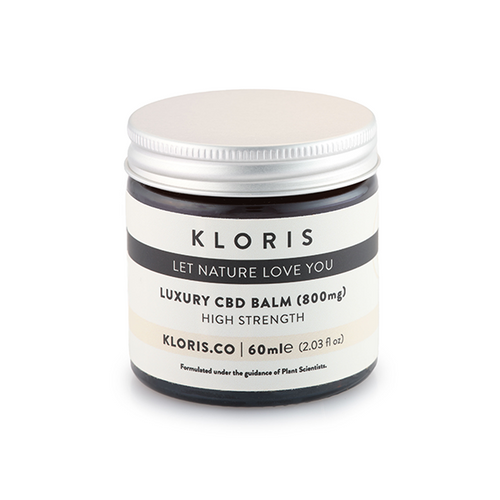 A 60ml dark brown jar of Kloris 800mg Luxury CBD Balm with a silver lid. The label reads 