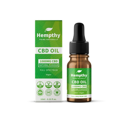 A 10ml bottle of Hempthy 1000mg CBD Oil Full Spectrum Natural is displayed next to its distinctive green and white box. Labels highlight that it contains full spectrum CBD, is vegan, and holds quality certifications such as ISO, GMP, and laboratory tested. The dropper cap bottle proudly exemplifies premium CBD products from the trusted brand Hempthy.