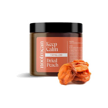 Load image into Gallery viewer, A jar labeled &quot;Nootrocan 750mg Full Spectrum CBD Nootropic Dried Fruits - 300g&quot; with a black lid. The jar is predominantly brown with orange accents. In front of the jar, a few dried peach slices are placed on the surface, adding a natural, vegan-friendly touch to the product display.
